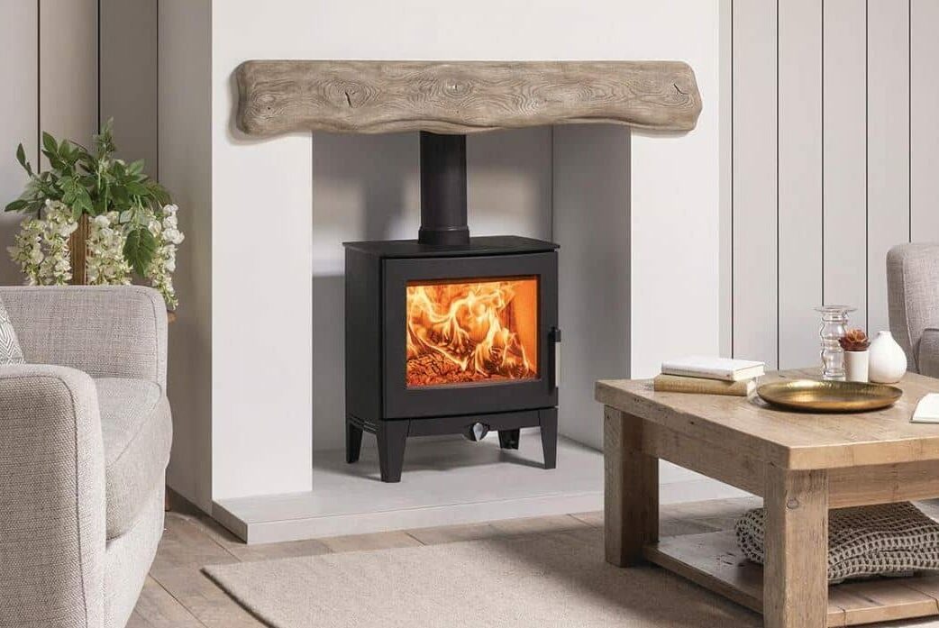 a stove inset into a chimney place